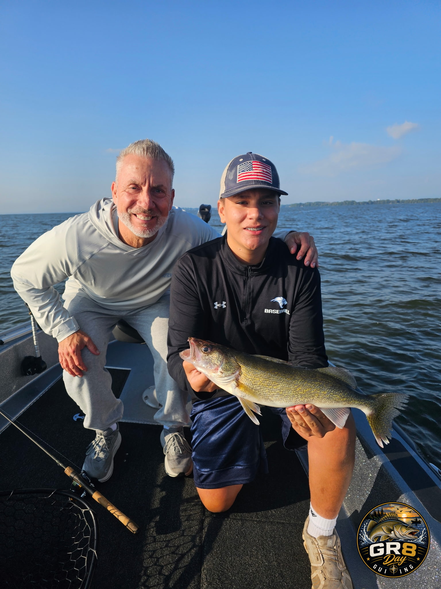 Anglers with a walleye during a Great Day Guide Service fishing trip